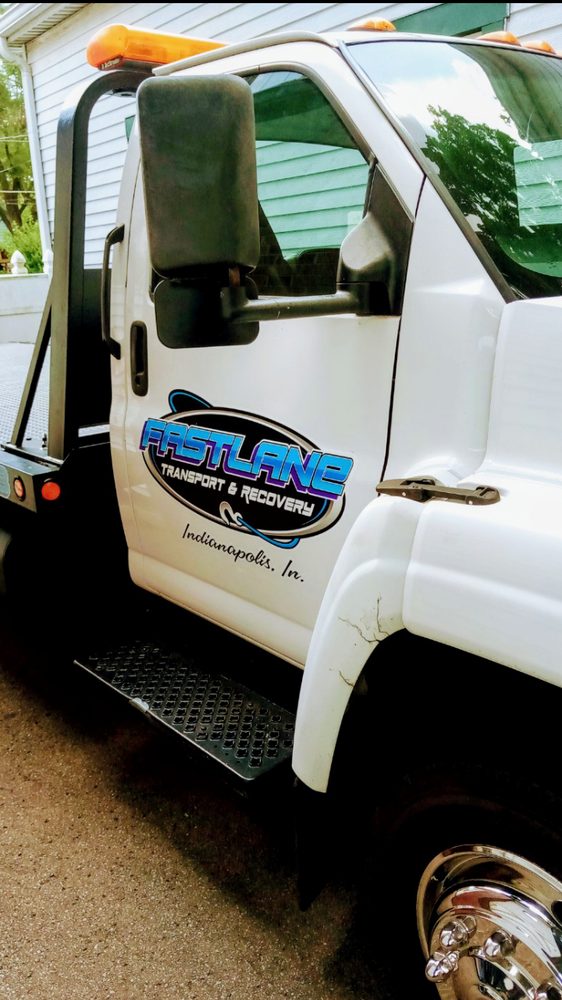 Fast Lane flatbed truck with company branding in Indianapolis