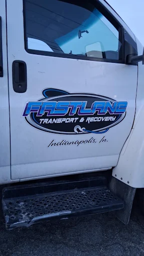 Fast Lane Transport & Recovery logo on the truck door